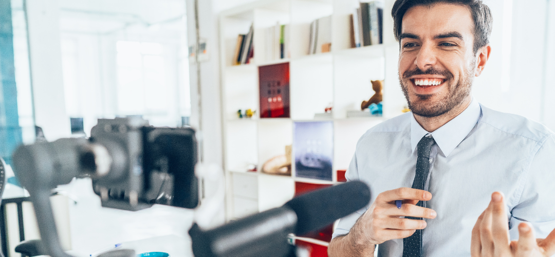 buisness man recording marketing video with Smartphone and microphone for his website